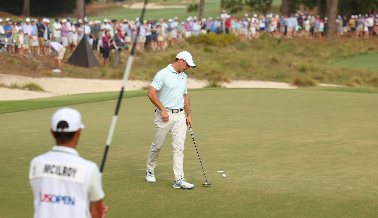 Rory McIlroy reacts after missing a par putt at the 18th hole during the US Open