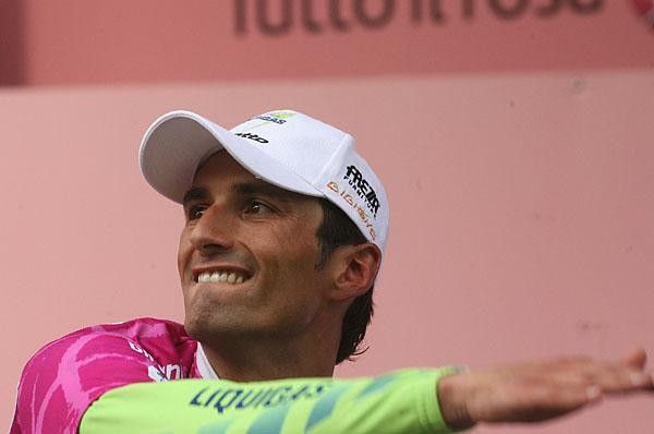 Bennati demonstrates his follow through after lobbing the flowers into the crowd.