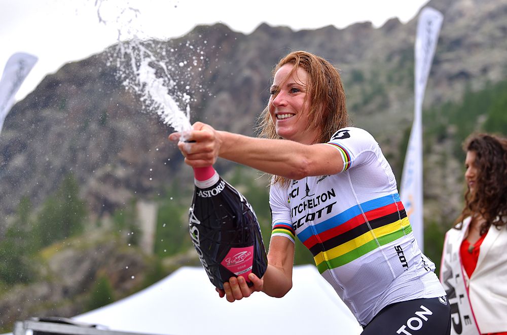 Annemiek Van Vleuten (Mitchelton-Scott) busts open the podium drinks