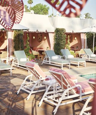 The Beverly Hills Hotel stripe sun loungers and cabanas