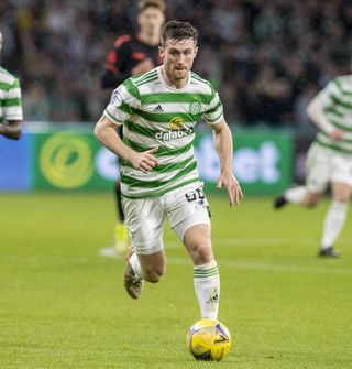 Celtic's Anthony Ralston runs forward with the ball at his feet