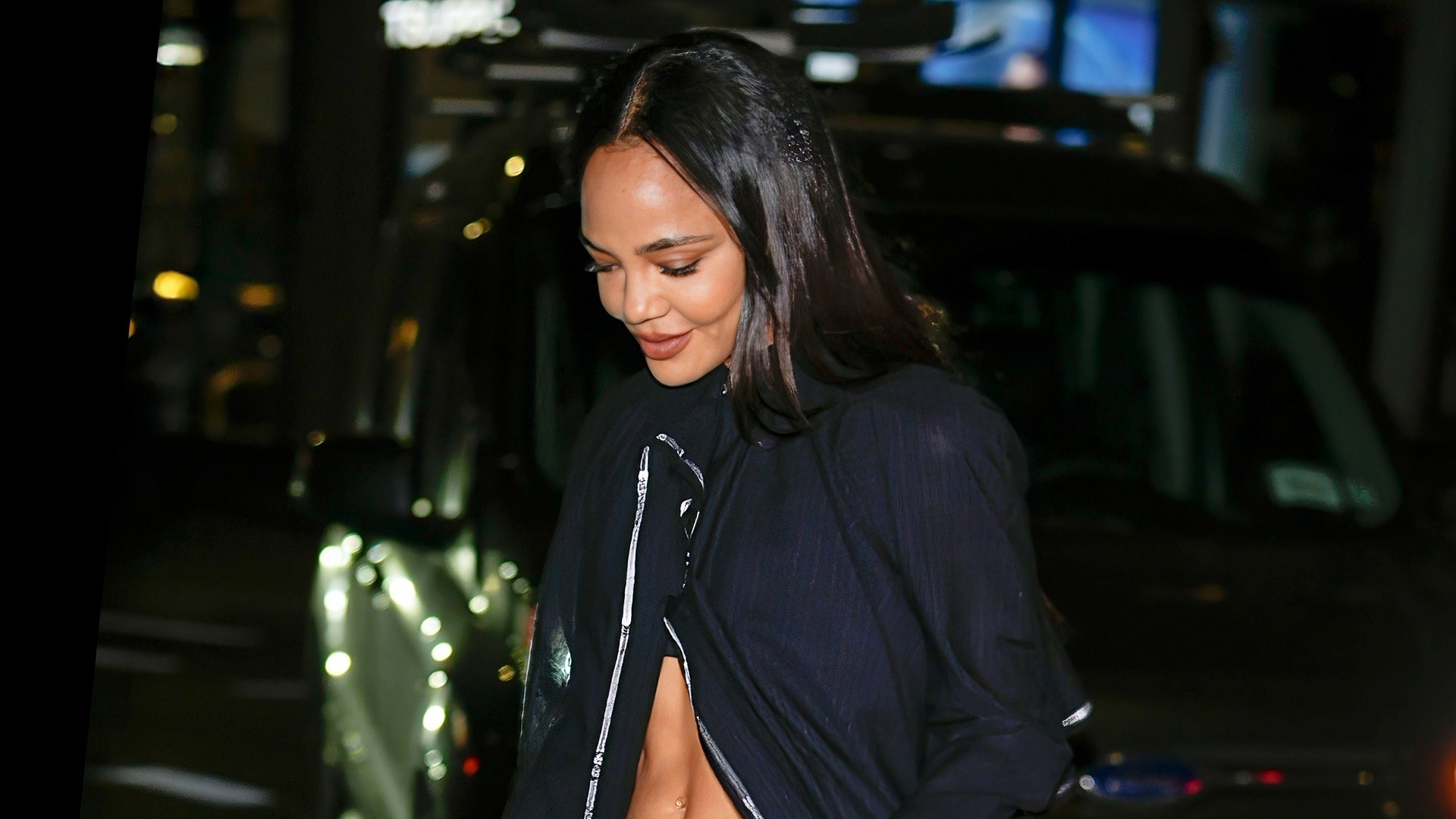 Tessa Thompson wearing a black jacket and skirt with Ugg Zora ballet flats in NYC