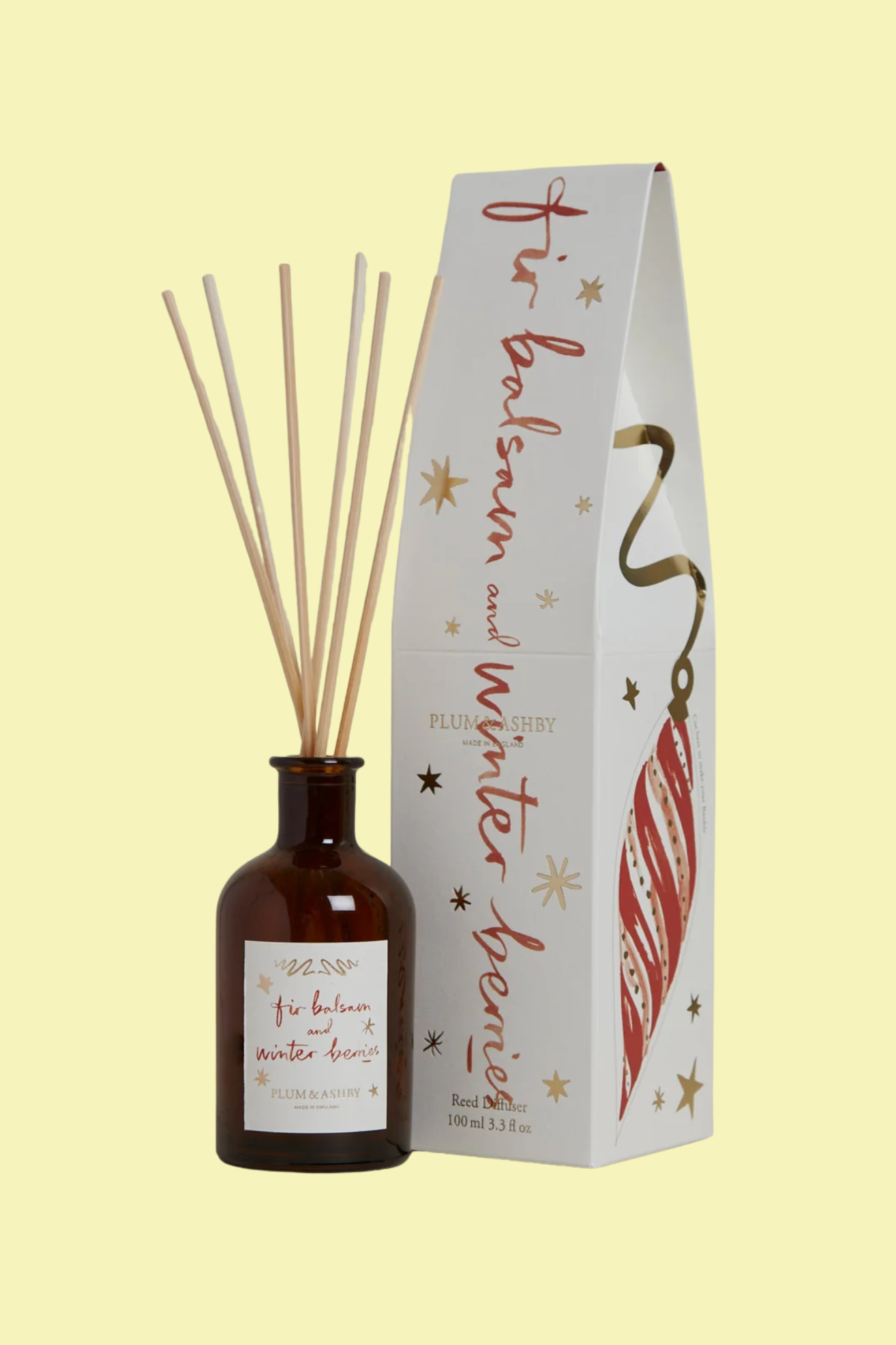 A glass diffuser with wood reeds