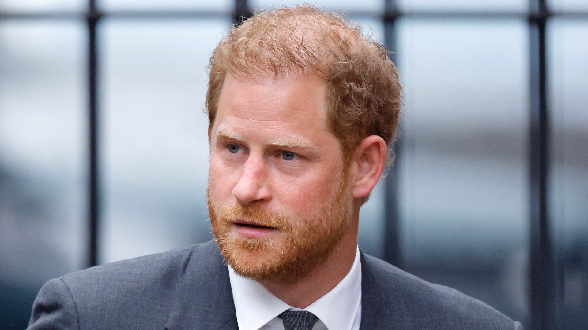 Prince Harry in London wearing a suit