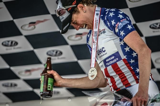 Alison Powers (UnitedHealthcare) celebrates with a podium beer after her win