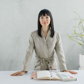 marie kondo with white table and books
