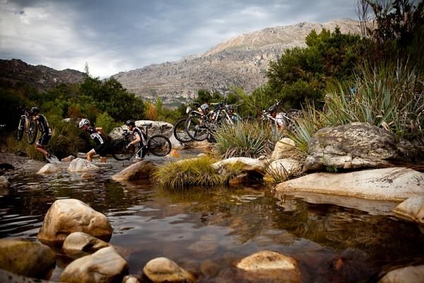 A long line of riders at the river crossing