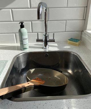 An Our Place Always Pan in sink with MOAM organic washing-up liquid dish soap and sponge