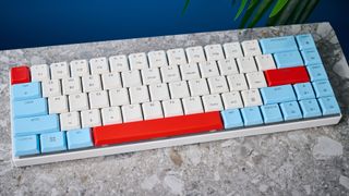 A Cherry MX LP 2.1 low-profile keyboard with red, white and blue keycaps