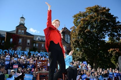 Elizabeth Warren waves to the crowd at a Hillary Clinton rally in 2016.
