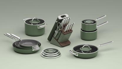A set of green cookware with silver handles and glass lids. A matching green knife block in the middle of them all, on a green background.