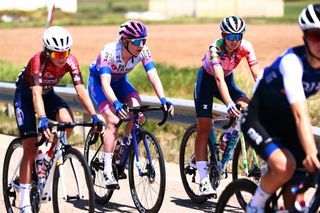 Pauliena Rooijakkers of Canyon-SRAM Racing rides alongside Nina Kessler of Team BikeExchange-Jayco during windswept opening day at Vuelta a Burgos Feminas
