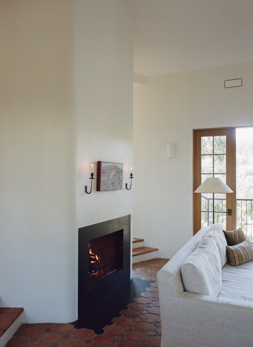 A living room with original fireplace