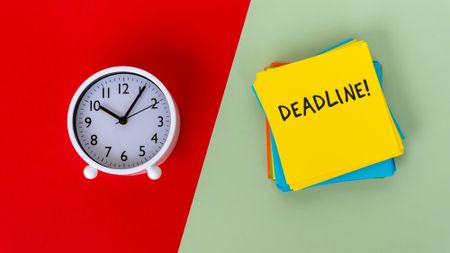 Clock and a sticky note that reads "Deadline!" on a green and red background