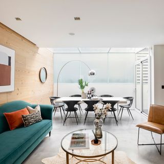 living room with glass top table and sofa