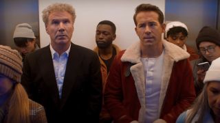 Will Ferrell and Ryan Reynolds awkwardly stand in a crowded elevator in Spirited.