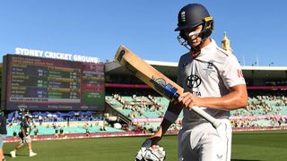 England batter Jacob Bethell walks off the field after scoring an unbeaten century on the fourth day of the 5th Ashes Test against Australia at Sydney.