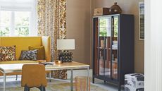 Yellow high back bench in home office room with taupe walls and vintage curtains