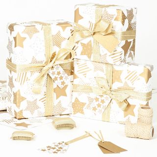 Sophia Victoria Joy gold stars white wrapping paper