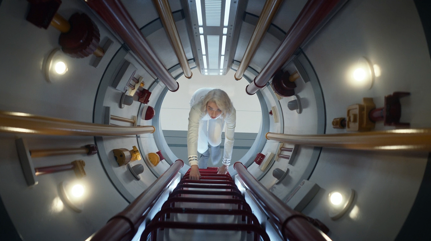 Nurse Chapel climbs a ladder in the Jeffries Tube on the USS Enterprise.