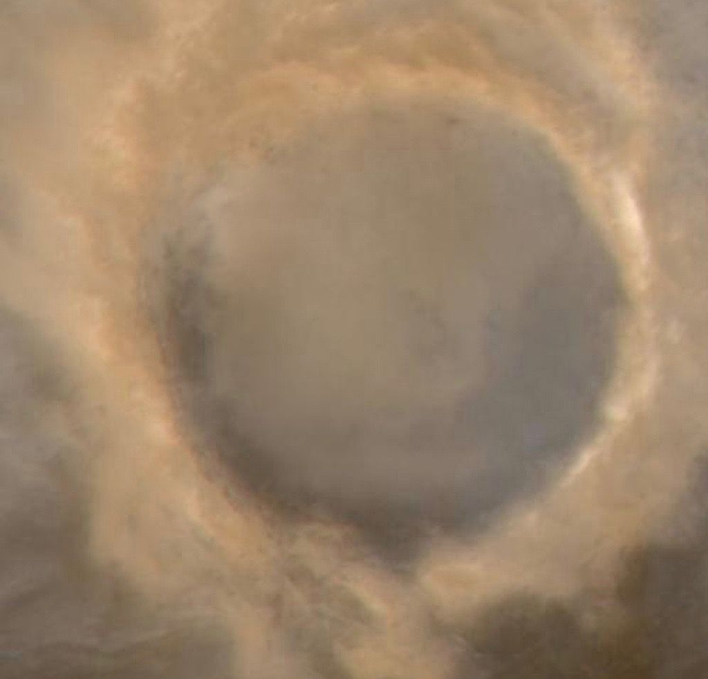 Mars&#039; 75-mile-wide (120 kilometers) Lomonosov Crater, as seen by NASA&#039;s Mars Global Surveyor orbiter.