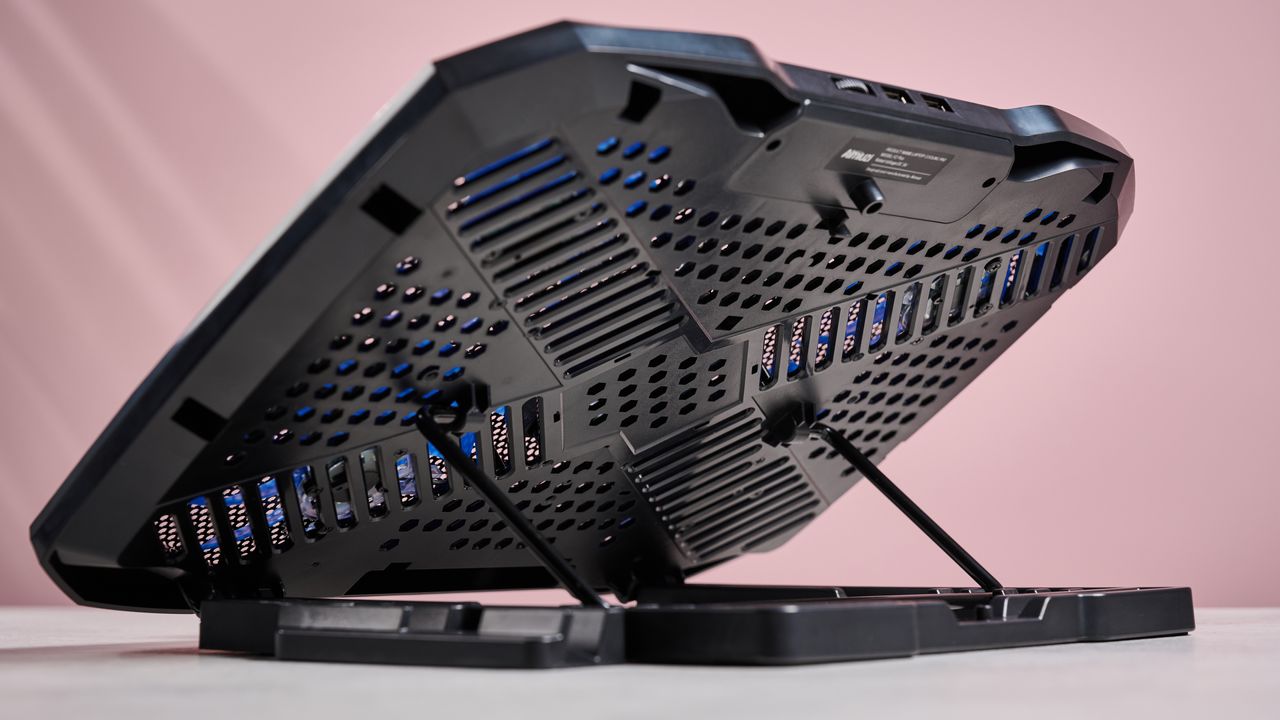 The underside of the Aimuzi F2 Plus laptop cooling pad while it's propped up using its built-in stand.