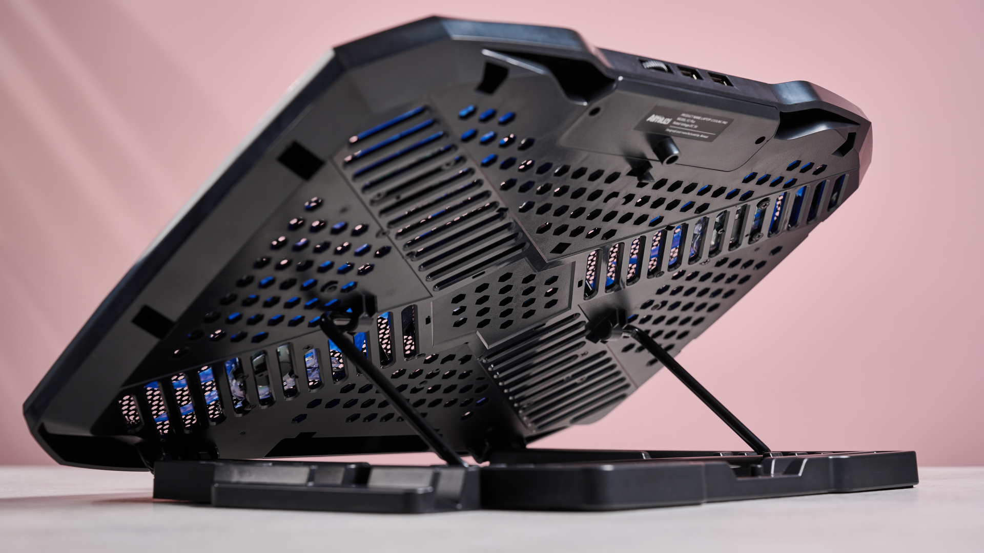 The underside of the Aimuzi F2 Plus laptop cooling pad while it's propped up using its built-in stand.