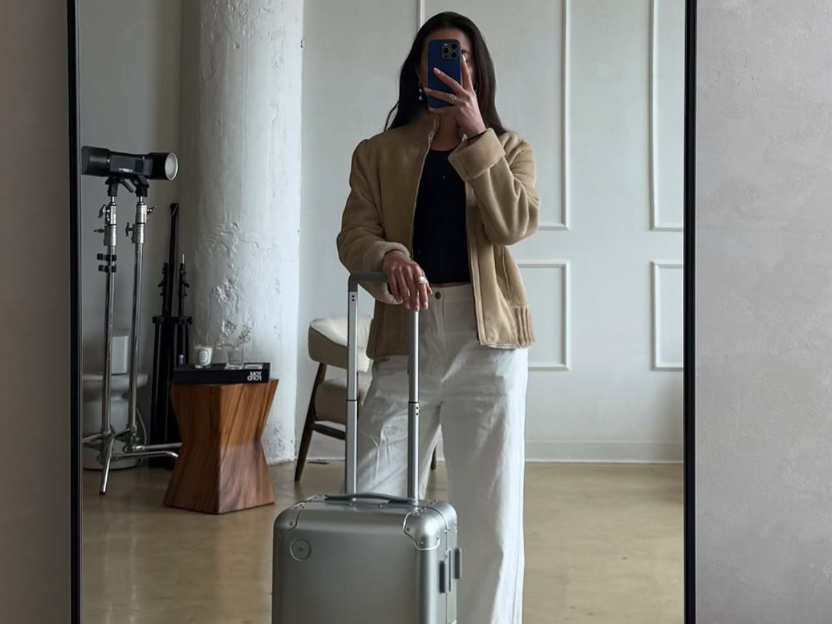 Woman wearing chic airport outfit 2025.
