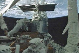 Spacewalkers Make Tricky Repairs to Hubble Camera