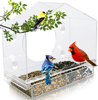 Wild Birds of Joy Bird House Window Bird Feeder $21.95
With a tray that locks in place and holds up to three cups of seed, watch cardinals, blue jays, finches, juncos, chickadees, nuthatches, titmice, sparrows and more enjoy themselves through this completely see-through, transparent feeder.