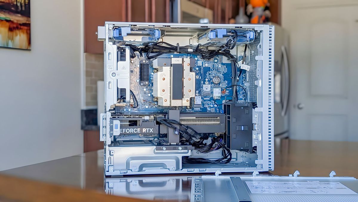 A side view of the Dell Tower Plus EBT2250 with the side panel removed so the internals are visible.