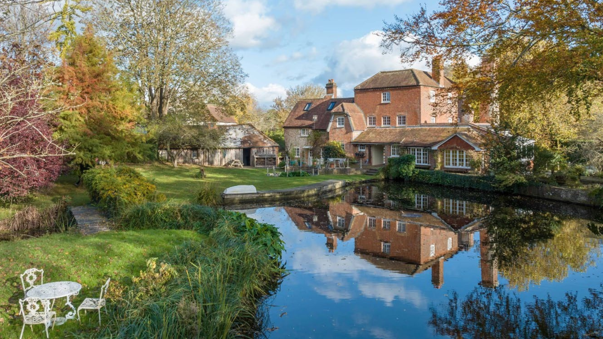 Converted 17th century former mill, with gardens and woodland on the banks of the Pagham Rife river.