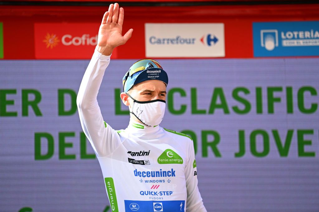BURGOS SPAIN AUGUST 15 Andrea Bagioli of Italy and Team Deceuninck QuickStep celebrates winning the White Best Young Jersey on the podium ceremony after the 76th Tour of Spain 2021 Stage 2 a 1667km stage from Caleruega Monasterio de Santo Domingo de Guzmn to Burgos Gamonal lavuelta LaVuelta21 CapitalMundialdelCiclismo on August 15 2021 in Burgos Spain Photo by Stuart FranklinGetty Images