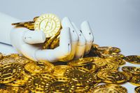 robotic hand holding bitcoin
