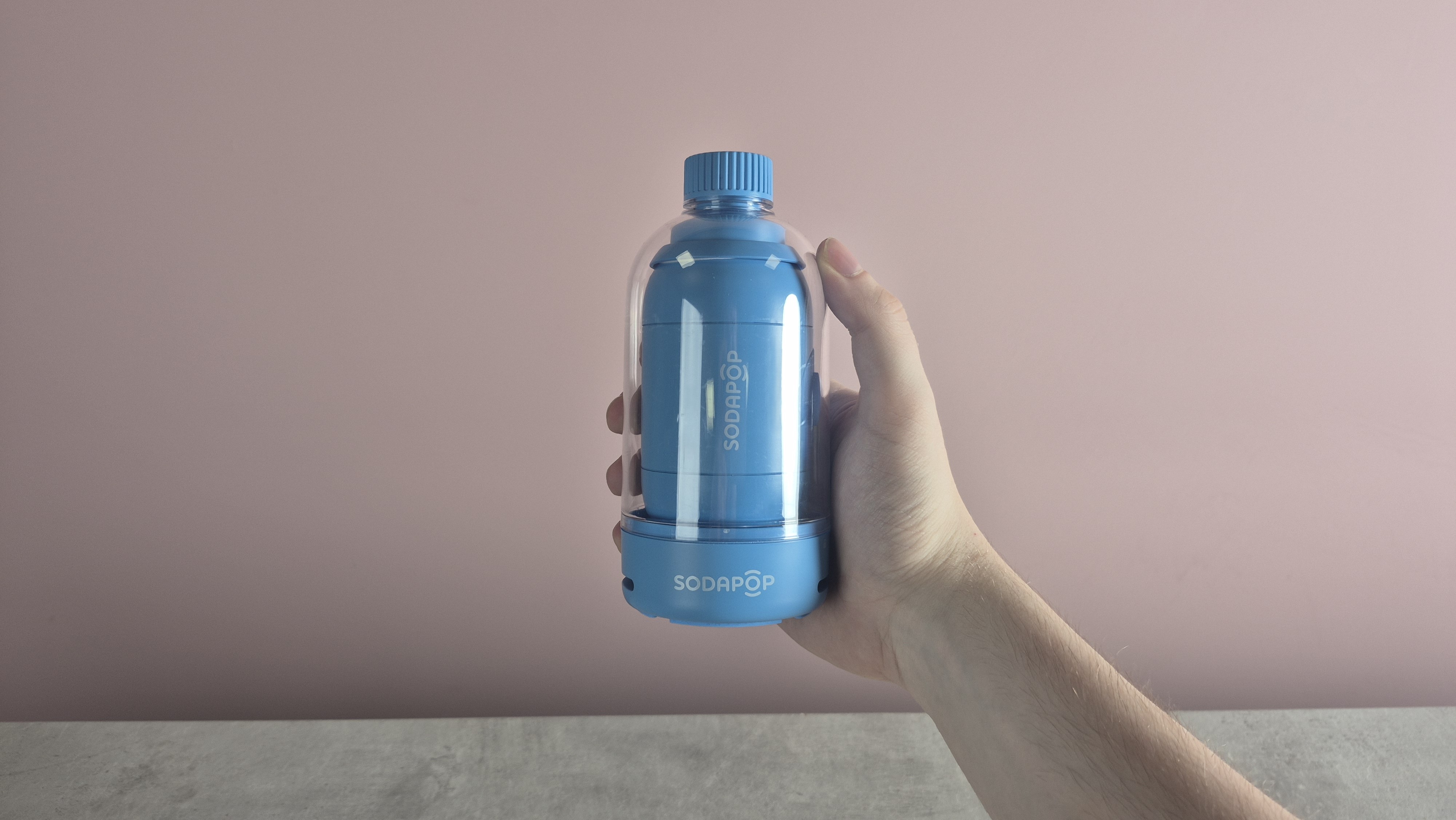 Person holding the Sodapop Bluetooth speaker