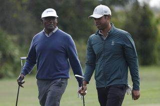 Vijay and Qass Singh walk down the fairway during the PNC Championship