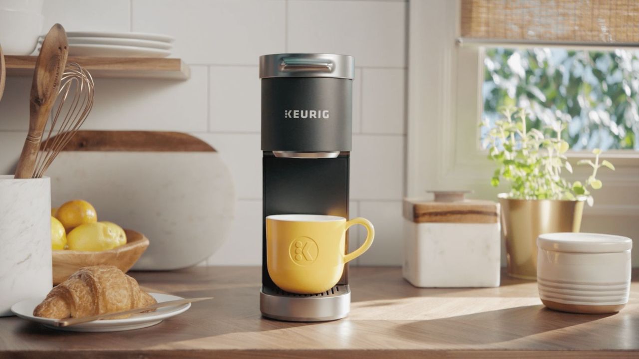 Keurig K-Express on a countertop with a yellow cup