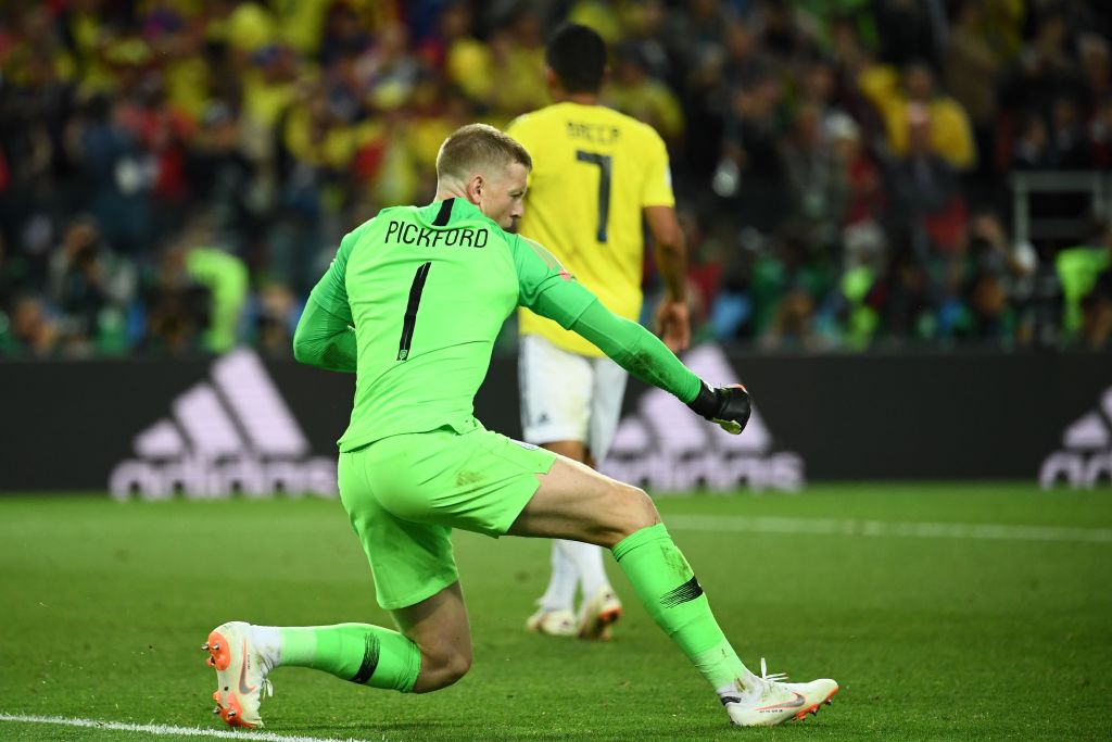 TOPSHOT - England&amp;apos;s goalkeeper Jordan Pickford reacts after stopping the penalty kick of Colombia&amp;apos;s forward Carlos Bacca (rear C) during the penalty shoot-out of the Russia 2018 World Cup round of 16 football match between Colombia and England at the Spartak Stadium in Moscow on July 3, 2018. (Photo by FRANCK FIFE / AFP) / RESTRICTED TO EDITORIAL USE - NO MOBILE PUSH ALERTS/DOWNLOADS        (Photo credit should read FRANCK FIFE/AFP via Getty Images)