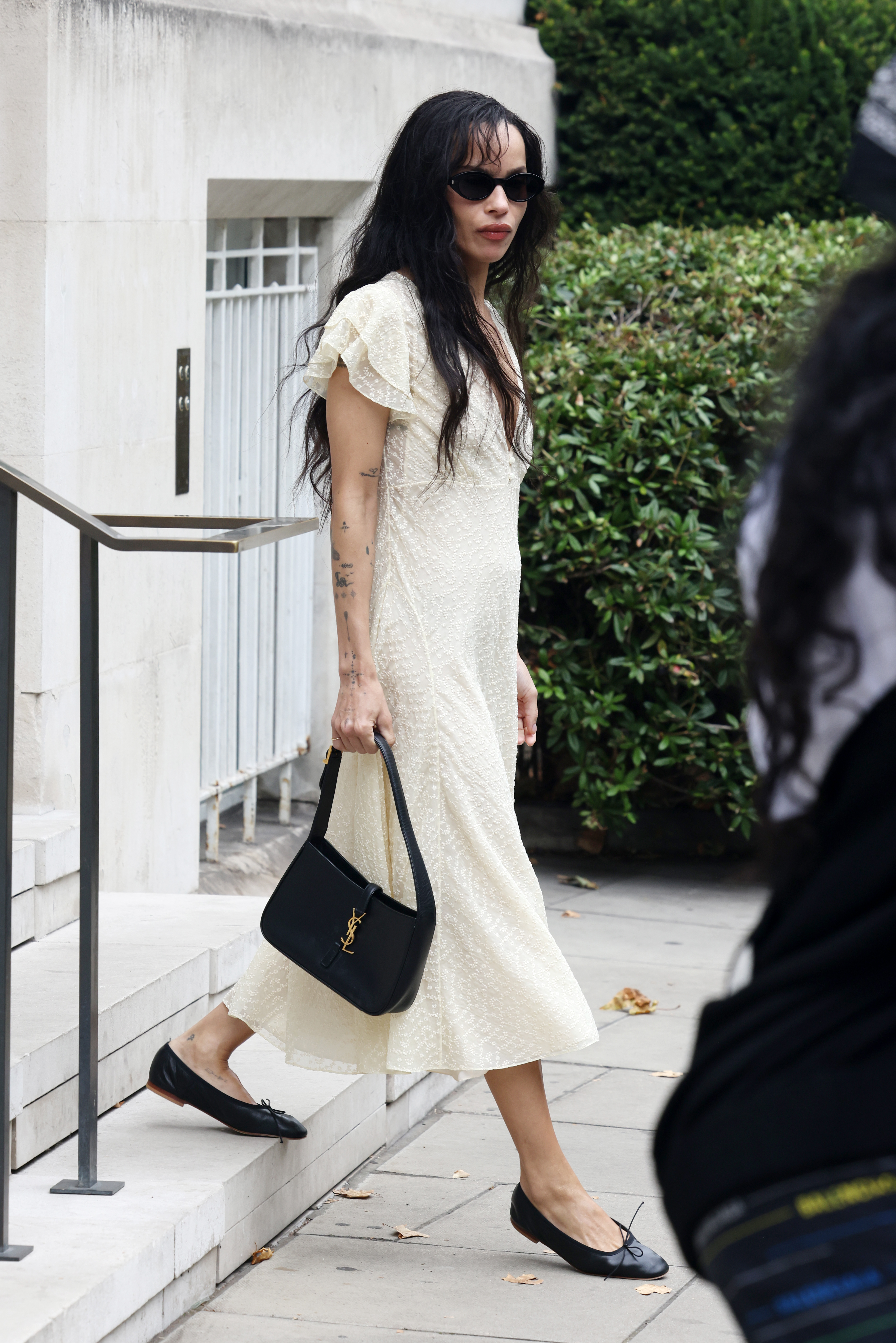 Zoe Kravitz holding a Saint Laurent bag.