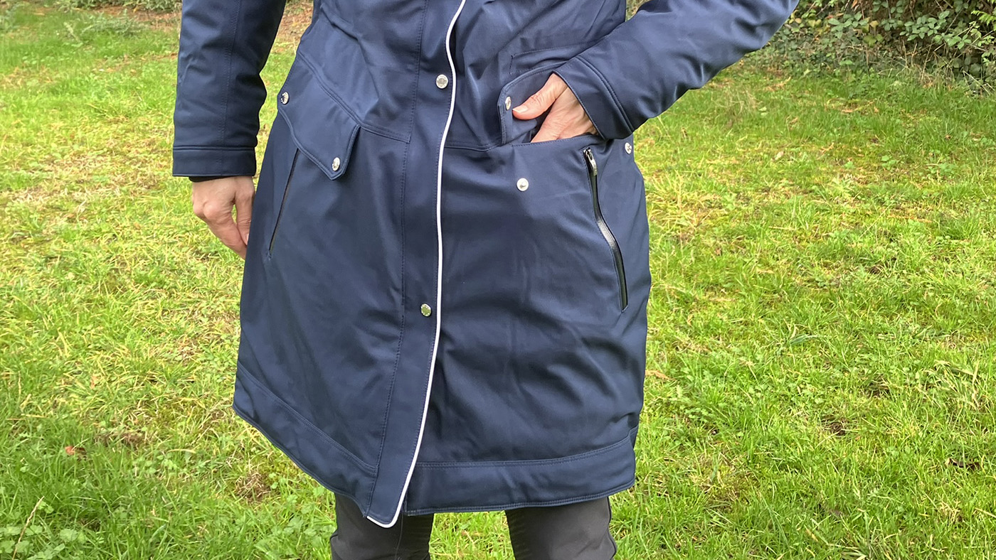 Showing the pockets on the Ariat Tempest Waterproof Insulated Parka