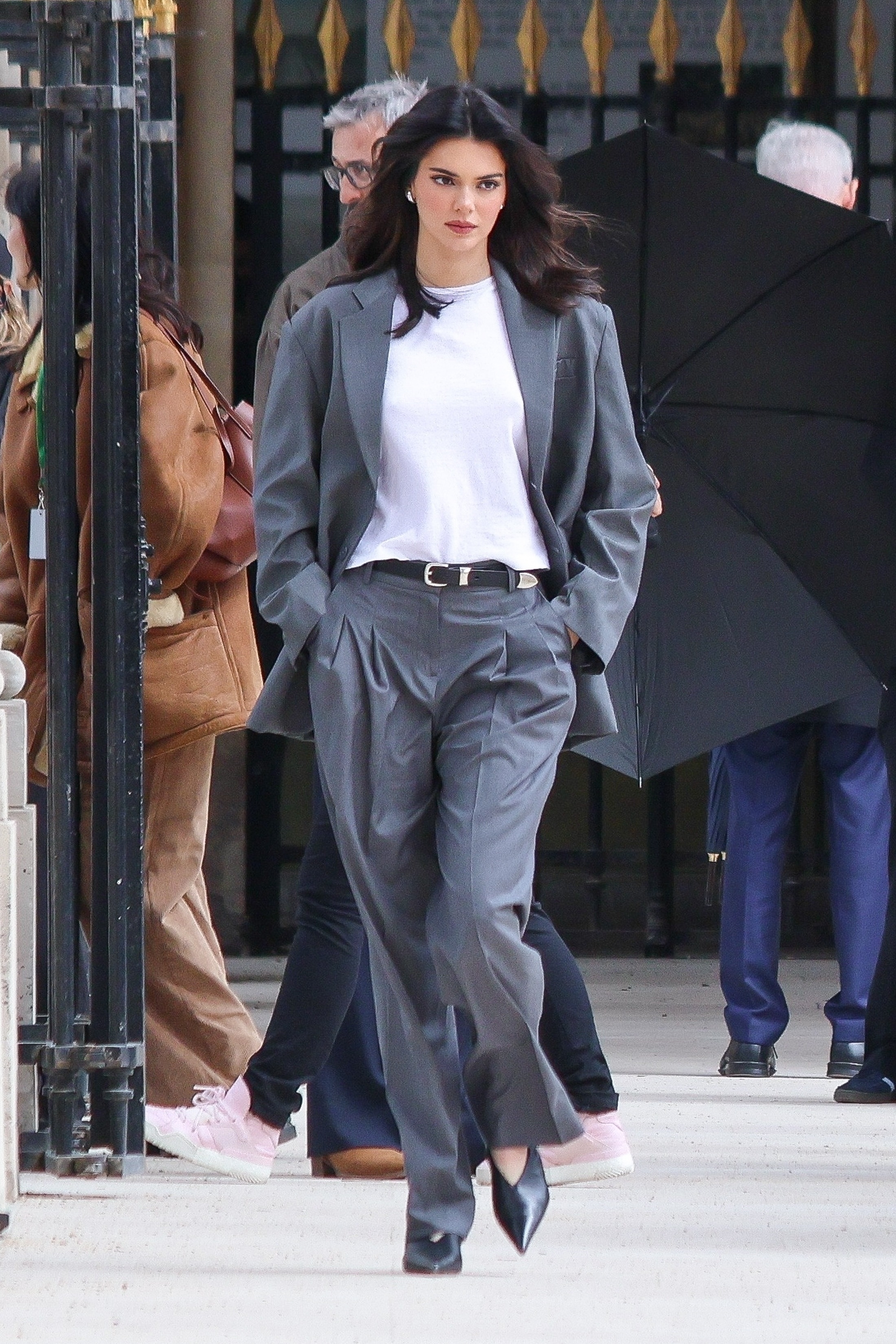 Kendall Jenner wearing a gray suit set and white t-shirt