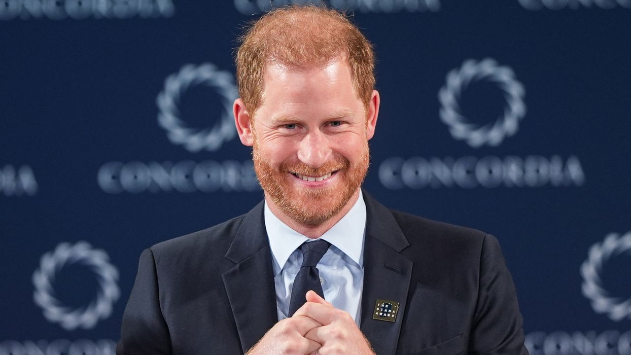 Prince Harry smiles onstage while wearing a suit at the 2024 Concordia Annual Summit in New York on September 23, 2024