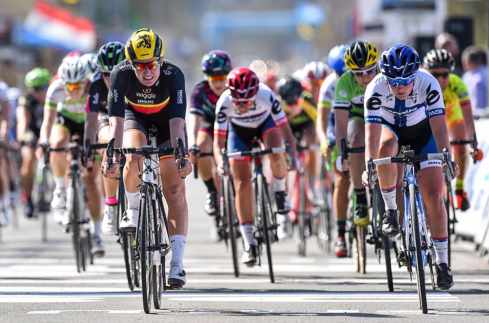 Jolien D'hoore crosses the line ahead of a chase group for 27th place at 2016 Tour of Flanders