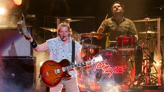 Ted Nugent (L) and Jason Hartless perform during his Adios Mofo 2023 Tour at Michigan Lottery Amphitheatre on August 11, 2023 in Sterling Heights, Michigan