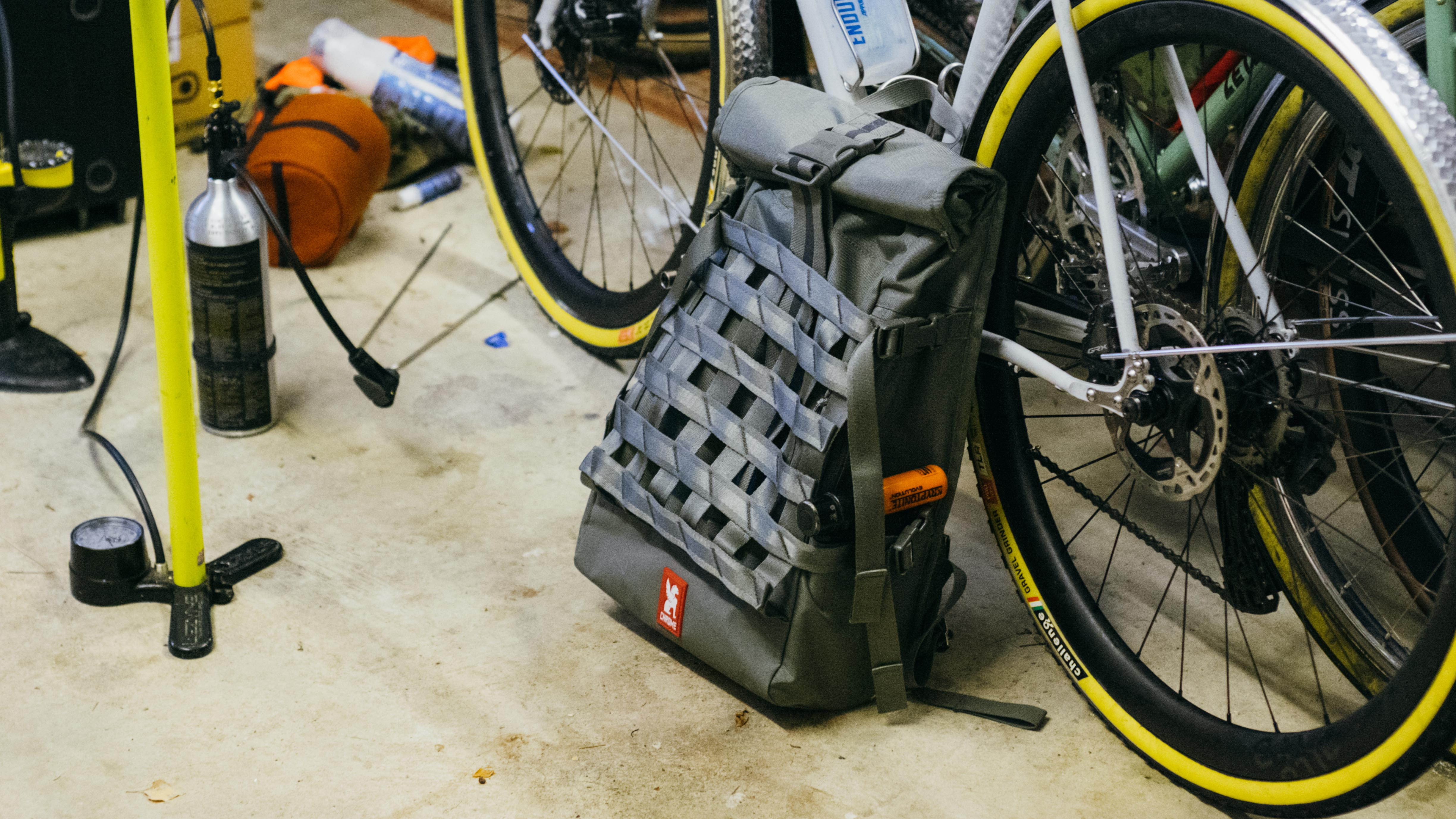 A backpack on a garage floor