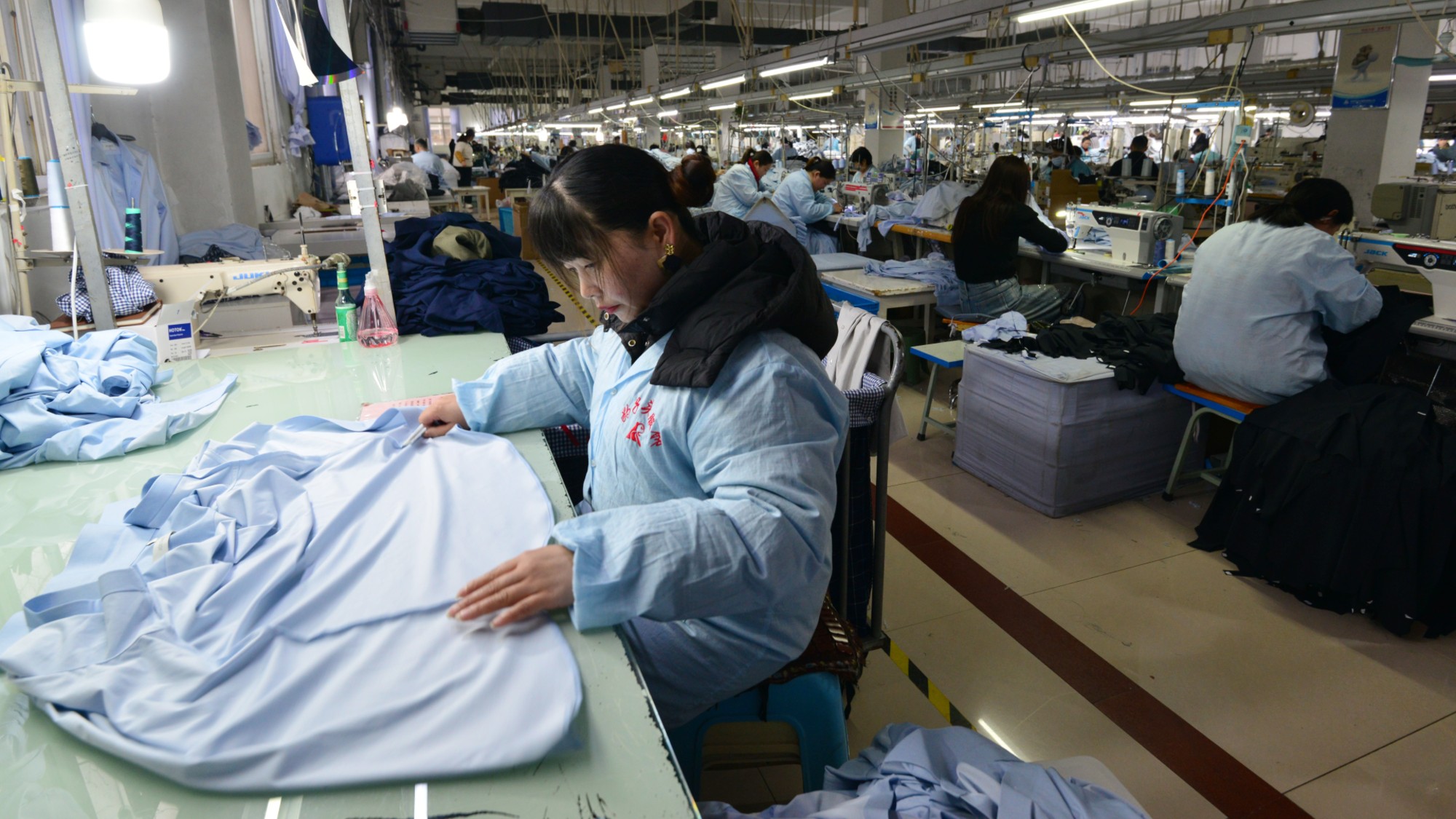 Workers assemble clothing at a factory in Fuyang, China.