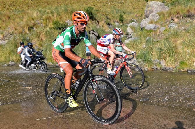 Riding through a little overflow water.