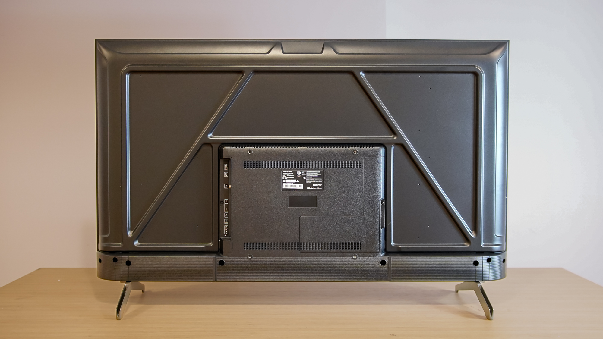 A rear view of the Sharp Aquos QLED TV on a table