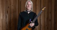 Steve Morse poses in the studio with his Ernie Ball Music Man signature model &ndash; not the guitar synth at the bridge.