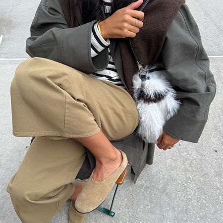 Woman in beige pants and flat shoes